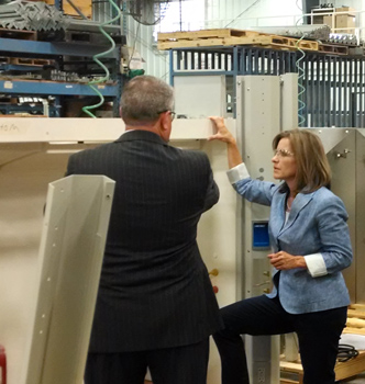 Congresswoman Jenkins climbs into fume hood in Fort Scott